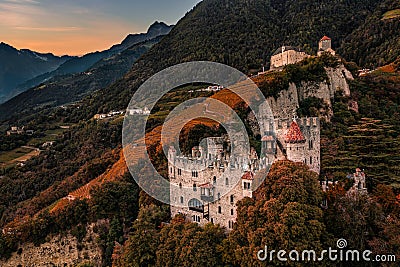 Merano, Italy - Aerial view of the famous Castle Brunnenburg with Tyrol Castle at background in the Italian Dolomites Stock Photo