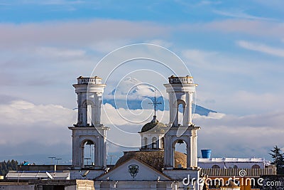 Merced church with Cotopaxi volcano in the background Latacunga Stock Photo