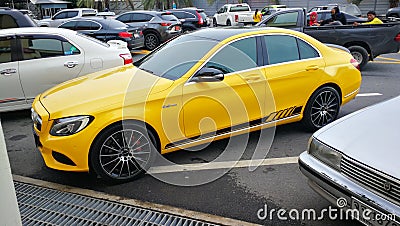Mercedes Benz in Bright Yellow parked Editorial Stock Photo