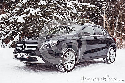 Mercedes Benz GLA 250 on a snow-covered street outside the city. Editorial Stock Photo