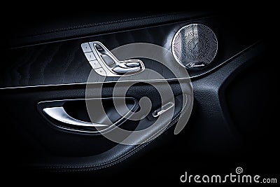 Mercedes Benz Interior Side Door with Silver Controls and Black Background. Editorial Stock Photo