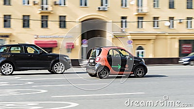 Mercedes Benz Smart car of Moscow carsharing company You Drive on the road in motion Editorial Stock Photo