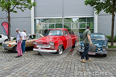 Mercedes-Benz W126 (left), Chevrolet Apache (Task Force) and the Mercedes-Benz W108 (right) Editorial Stock Photo