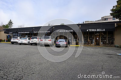 Downtown Mercer Island, weathered parking lot, strip mall with small businesses Editorial Stock Photo
