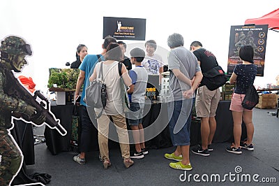 A merchandise booth at the Army Open House event in Singapore Editorial Stock Photo