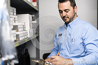 Merchandiser checking products availibility for car repair Stock Photo