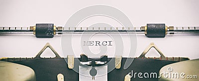 Merci word in capital letters on a typewriter sheet Stock Photo