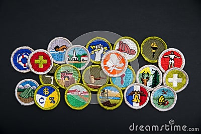 Merit badges on black Editorial Stock Photo