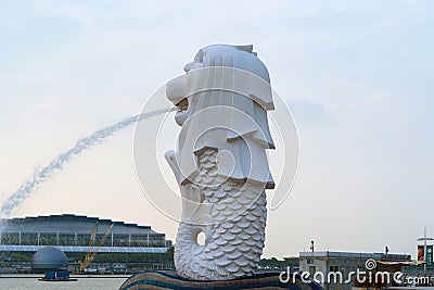Merlion with skyscraper buildings in Singapore City at noon. Financial district in downtown with business centers in technology Editorial Stock Photo