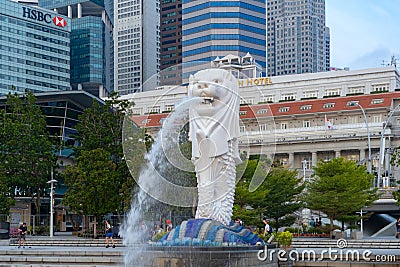 Merlion with skyscraper buildings in Singapore City at noon. Financial district in downtown with business centers in technology Editorial Stock Photo