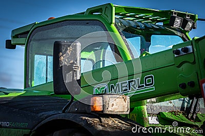 Merlo farming equipment, tractor lifting straw bale Editorial Stock Photo
