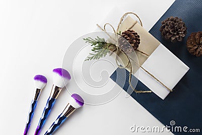 Mermaid ombre make up brush set and gift box on navy blue paper Stock Photo