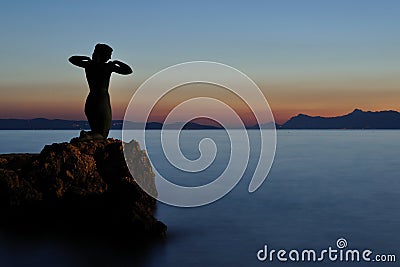 Statue of mermaid in Podgora in evening. Croatia Stock Photo