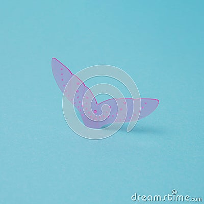 Mermaid tail with bubbles on blue background. Minimal design Stock Photo