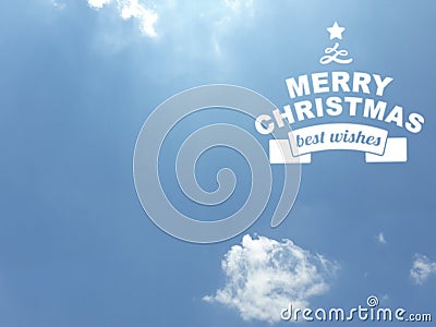 Merry Chistmas message in white color over a blue sky background Stock Photo