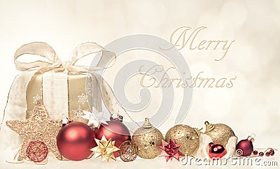 Merry Christmas Card with Gift and Ornaments Stock Photo