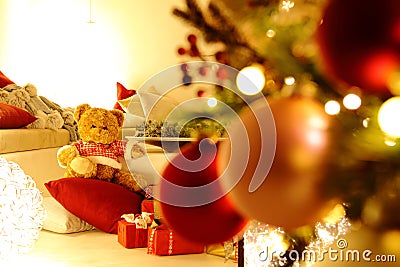Merry christmas, comfortable living room with lighted tree, decorations and gift packages Stock Photo