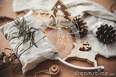 Merry Christmas, eco concept. Stylish rustic gift wrapped in lin Stock Photo