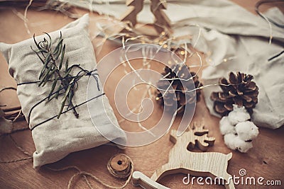 Merry Christmas, eco concept. Stylish rustic gift wrapped in lin Stock Photo