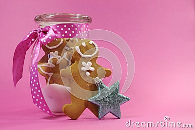 Merry Christmas festive gingerbread men in glass cookie jar with copy space Stock Photo