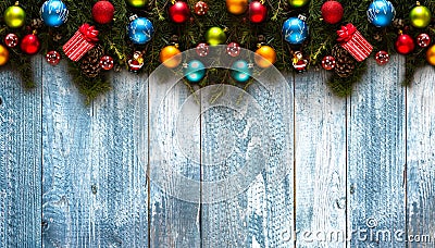 Merry Christmas Frame with real wood green pine and colorful baubles, Stock Photo