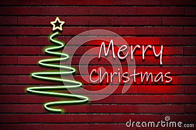 Merry Christmas glowing colorful neon light and xmas tree on brick wall Stock Photo
