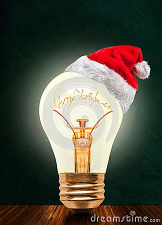 Merry Christmas Glowing Light Bulb With Santa Hat And Copy Space Stock Photo