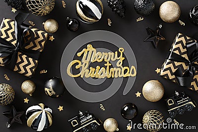 Merry Christmas greeting card. Chic, elegant art deco design with golden glitter accents. Festive flat lay composition on dark Stock Photo