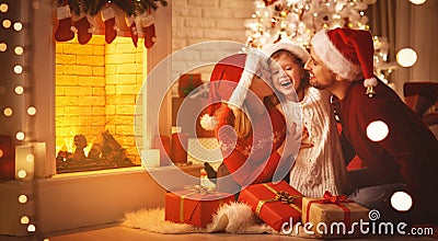 Merry Christmas! happy family mother father and child with gifts Stock Photo