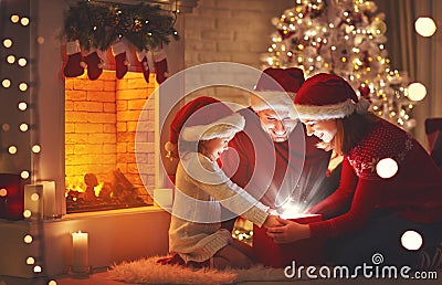 Merry Christmas! happy family mother father and child with magic Stock Photo