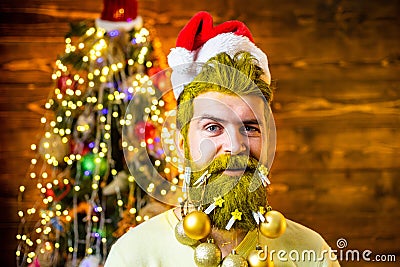 Merry Christmas and happy holidays. Bearded modern Santa Claus. Handsome Santa wearing in Christmas dress. New year Stock Photo