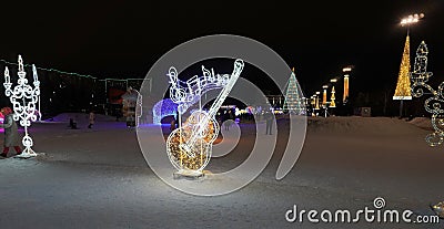 Merry Christmas and Happy New Year! Christmas in the city park. Christmas tree and illumination, luminous figures Editorial Stock Photo