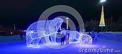 Merry Christmas and Happy New Year! Christmas in the city park. Christmas tree and illumination, luminous figures Editorial Stock Photo