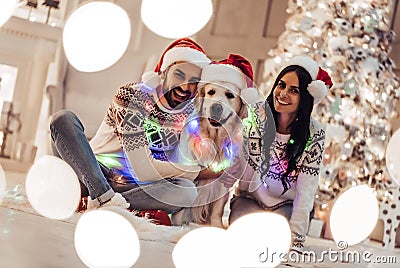 Couple with dog on New Year`s Eve Stock Photo