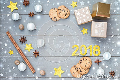 Merry Christmas and Happy New Year. Festive Christmas decoration with stars, mini gifts, text on the light gray Stock Photo