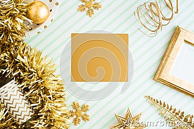 Merry christmas and happy new year gold greeting card view of sparkling gold tinsel,ball,ornament decorate on green strip line Stock Photo