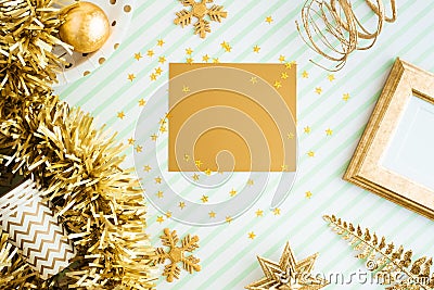 Merry christmas and happy new year gold greeting card view of sparkling gold tinsel,ball,ornament decorate on green strip line Stock Photo