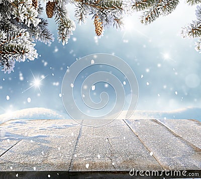 Christmas and happy new year greeting background with table .Winter landscape with fir tree Stock Photo