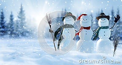 Merry Christmas and happy New Year greeting card with copy-space.Many snowmen standing in winter Christmas landscape.Winter Stock Photo