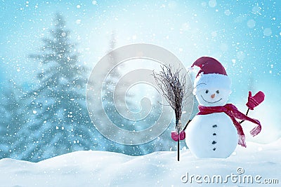 Christmas and happy new year greeting card with copy-space.Happy snowman standing in christmas landscape.Snow background. Stock Photo
