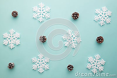 Merry Christmas and Happy New Year. Pattern foam cutter snowflake and dried pine on pastel color Stock Photo