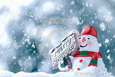 Merry Christmas and Happy New Year, Snowman with Snow Fall, happy greeting card and Christmas background concept. Stock Photo