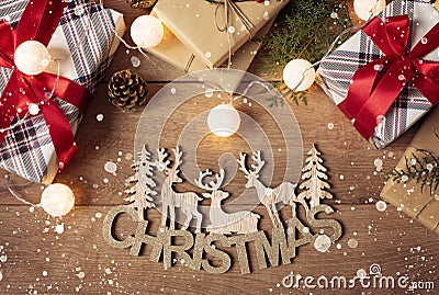 Merry Christmas Inscription, Fir Tree, Figures of Deers And Festive Gift Boxes. Winter Holidays And Happy New Year Concept. Flat Stock Photo