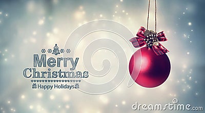 Merry Christmas message with a hanging bauble Stock Photo