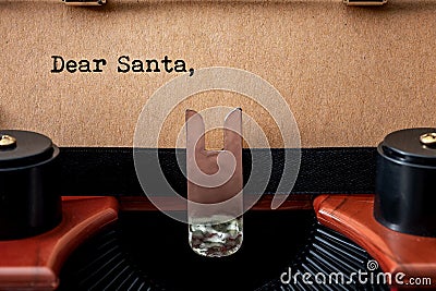 Merry Christmas, old fashioned wish list and Sending a letter to Santa Claus conceptual idea with close up on vintage typewriter Stock Photo