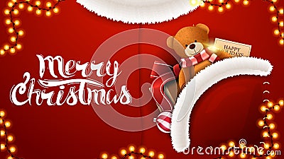 Merry Christmas, red postcard in form of Santa Claus costume with present with Teddy bear in pocket Stock Photo