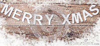 Merry Christmas sign on wooden background with copy space Stock Photo