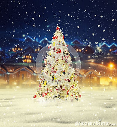 Merry christmas, snowy xmas tree with decoration Stock Photo