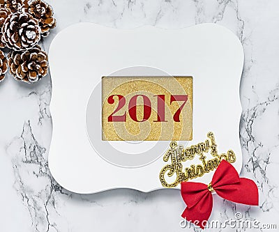 Merry christmas 2017 text in vintage white picture frame with pi Stock Photo