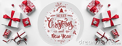 Merry Christmas Typographical on white background with gift boxes and red decoration. Stock Photo